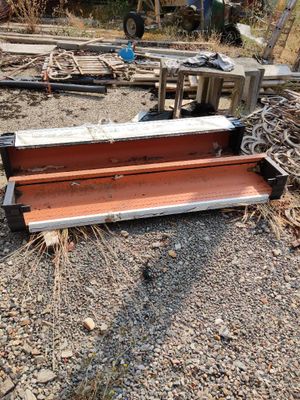 a bench that is sitting on the ground in the dirt