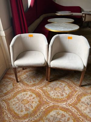 two chairs and a table in the corner of a room