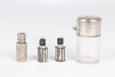 three salt and pepper shakers sitting next to each other
