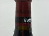 a bottle of wine that is sitting on a table