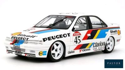 the car is white and blue with red, yellow, and blue stripes on it