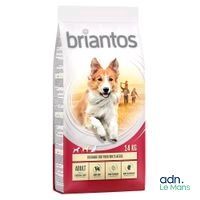 a bag of dog food with a dog running in the background
