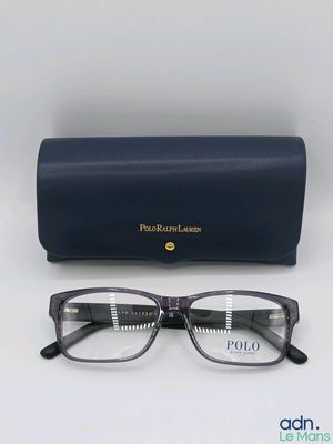 the pair of glasses are next to the case on the table