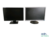 two monitors sitting next to each other on a white surface