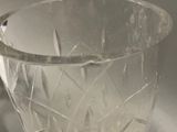 a clear glass vase sitting on a table