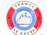 a red and white life preserver with a picture of a cruise ship on it