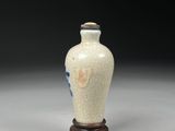 pair of vases with blue and white designs on them on a gray surface