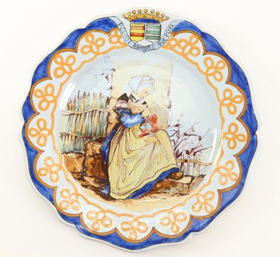 a plate with a picture of a woman sitting on a bench
