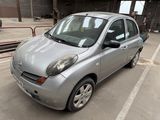 a picture of a silver car parked in a parking lot