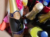 a box full of bottles of wine and eggs