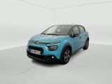 a blue car is parked in a white room