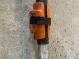 a close up of a pipe clamp attached to a pole