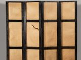 a close up of a folding screen with a window on it