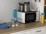 a microwave sitting on a counter in a kitchen