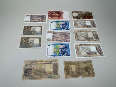 several different types of paper money laid out on a table