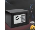 a black safe box with a key lock and a bunch of gold coins