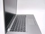 a close up of a laptop computer on a white surface