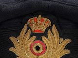 a close up of a hat with a crown on it