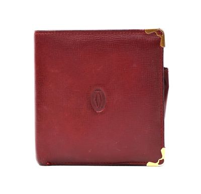 a red leather wallet with a gold clasp on the front