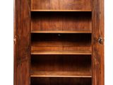 an antique wooden cabinet with open doors on a white background