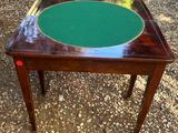 a small table with a green mat on top of it