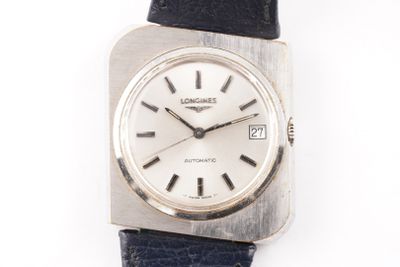 a silver watch with a black leather strap on a white surface