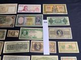 several different types of paper money laid out on a table