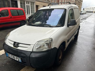 a white van that is parked on the side of the street