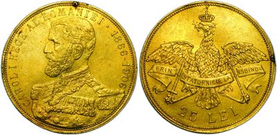 a close up of two gold coins with an eagle on top