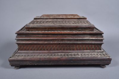 an old wooden box sitting on top of a table