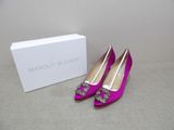 manolo blaho shoes with box and box on a table
