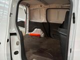 a white van with the door open and a bag in the back