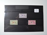 five different stamps on a piece of paper on the wall