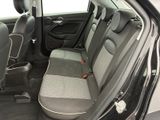 the back seats of a small car with the door open