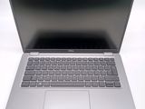an open laptop computer sitting on top of a white table