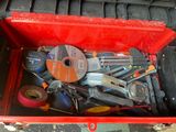 a red tool box filled with various tools on the floor