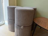 two stools sitting next to each other in a room