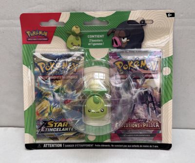 two packs of pokemon trading cards are in the packaging