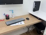 a computer desk with a monitor and keyboard on it