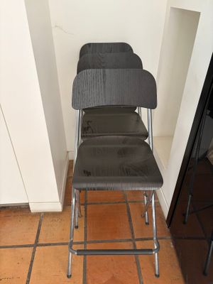 a chair that is sitting in a corner of a room