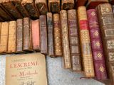 a lot of old books that are on the ground
