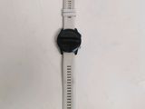 a close up of a smart watch on a white surface