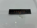 a close up of a ruler on a white surface with the word vauto written on it