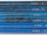 several rolls of blue tarps are stacked on top of each other
