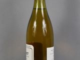 a bottle of wine that is sitting on a table