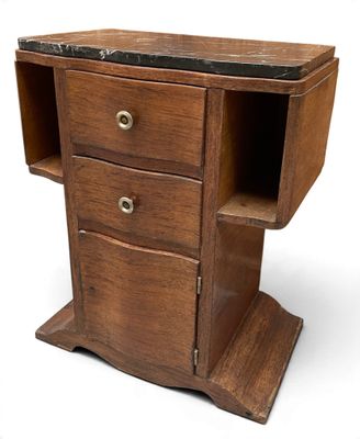 a small wooden desk with a marble top