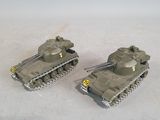 two toy tanks that are sitting on a table