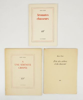 three books are sitting on a white surface next to each other