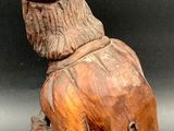 carved wooden elephant with a hat on top of it ' s head