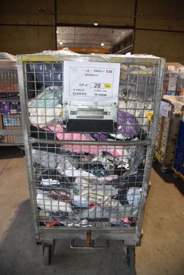 a cart with a lot of items inside of it